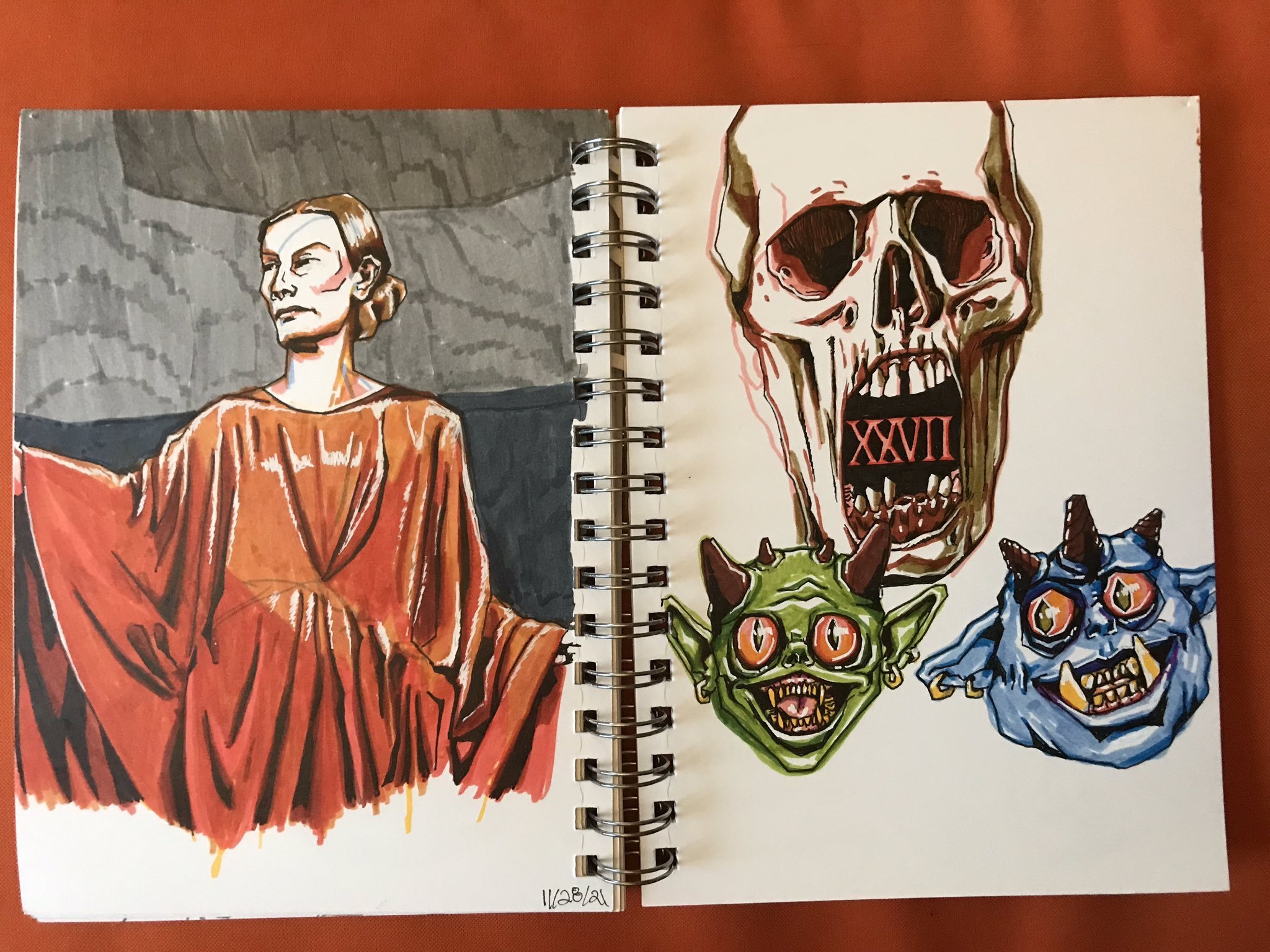 Photo of two sketchbook pages: one shows Tilda Swinton in Suspiria, the other is three ghoul faces: one scarier skull-like face, the other two more comical and goblin-esque