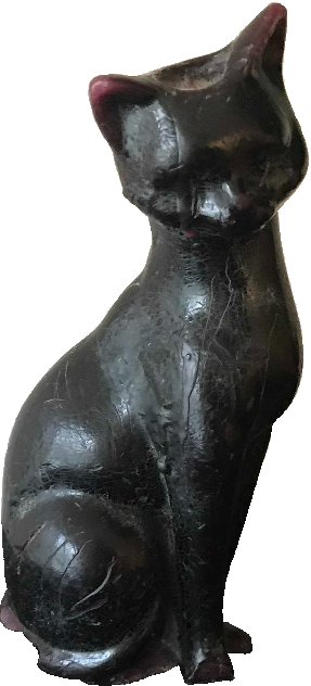 Cut out photo of a candle shaped like a black cat sitting gracefully