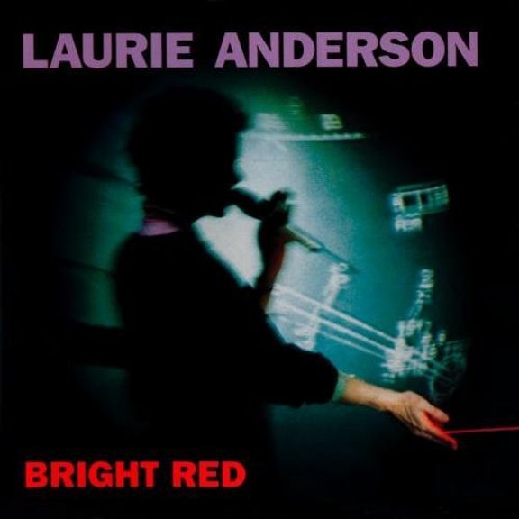 Laurie Anderson's album 'Bright Red'. The cover is mostly black with a silhouette of Laurie Anderson lit from behind by a shot of what I'm guessing is her electric violin, or some sort of electronic with, while she holds some sort of instrument in her left hand, and a laser either shoots out of her right hand, or hits it in the palm