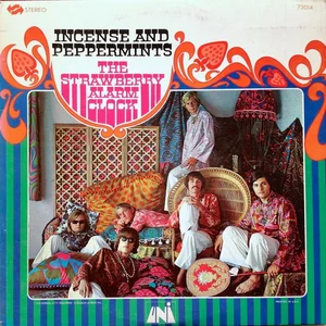 Album cover for Strawberry Alarm Clock's Incense and Peppermints album showing the band in colorful clothes lounging on a couch w/ colonialist undertones if i'm being honest